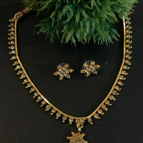 Golden stone necklace